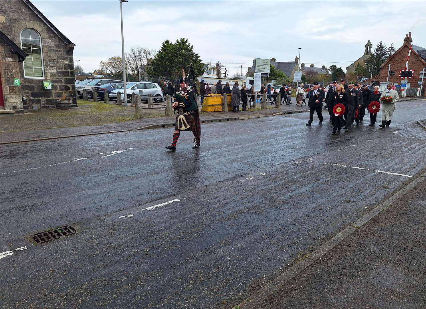 Military piper Colin Simpson led the parade from the Gower Street lorry park to the war memorial.