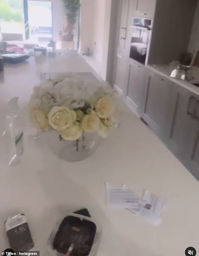 Meanwhile, the kitchen was given a more muted makeover, with white marble worktops and grey cupboards