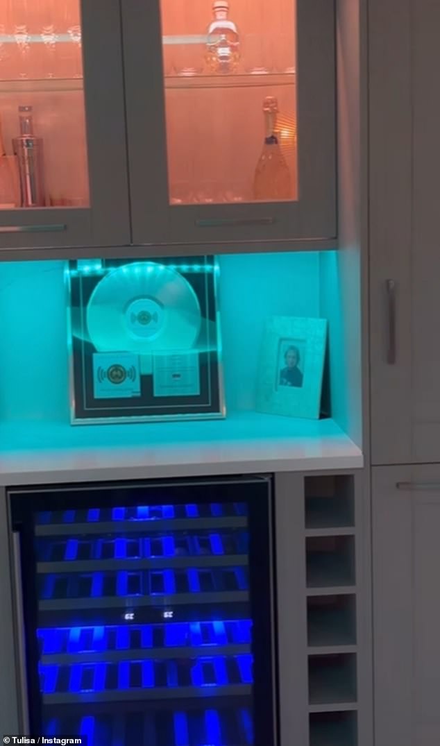 The N-Dubz star paid reference to her pop career with album artwork on the walls and above the wine fridge