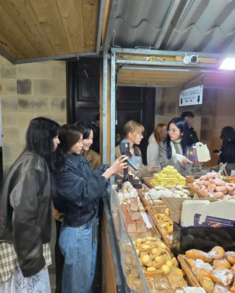 Yunjin / Instagram Le Sserafim at Manchester's Christmas Market