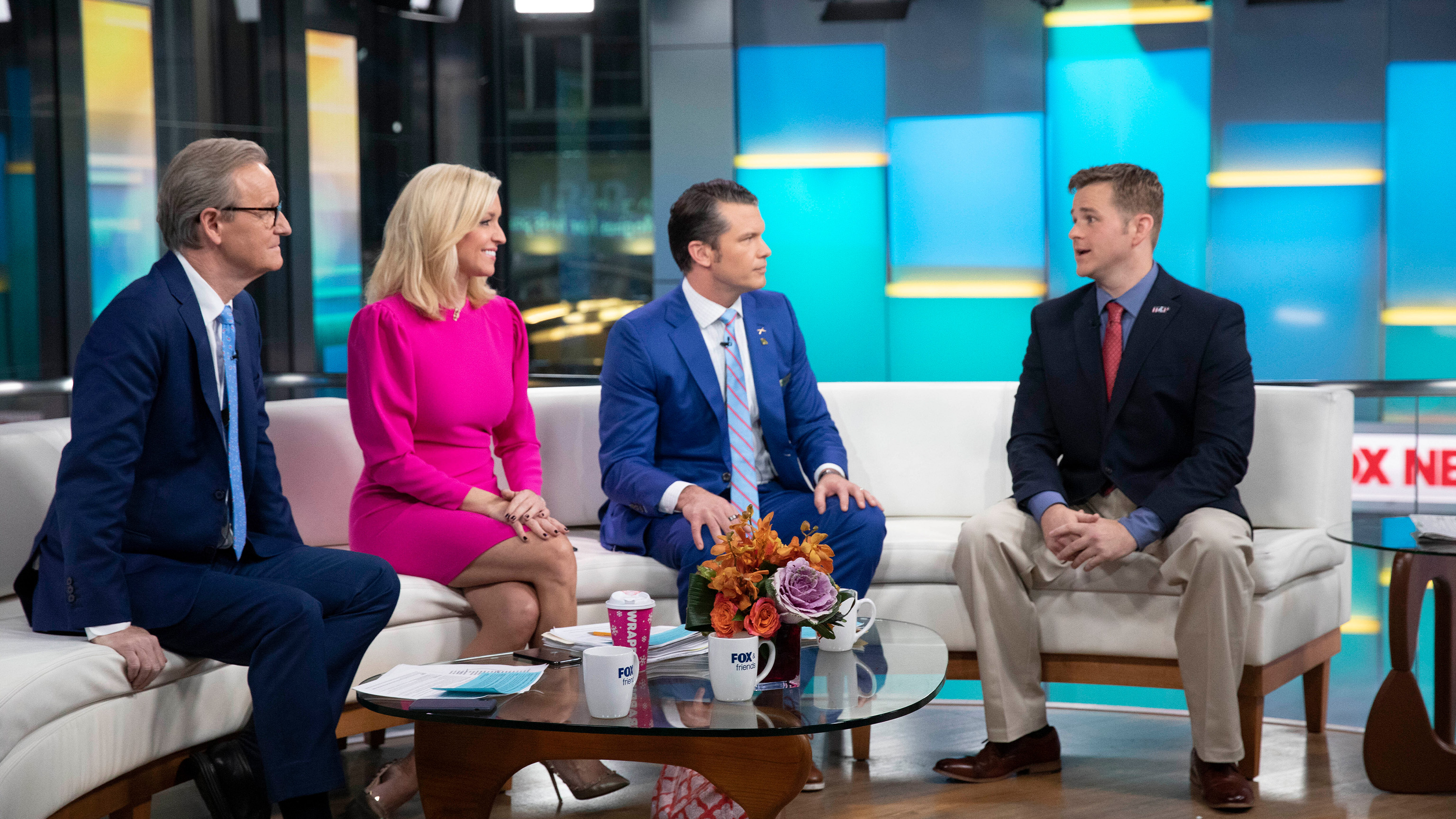 Steve Doocy, left, Ainsley Earnhardt, second left, and Pete Hegseth interview Army 1st Lt. Clint Lorance, right, on Fox & Friends, Monday, Nov. 18, 2019 in New York. 