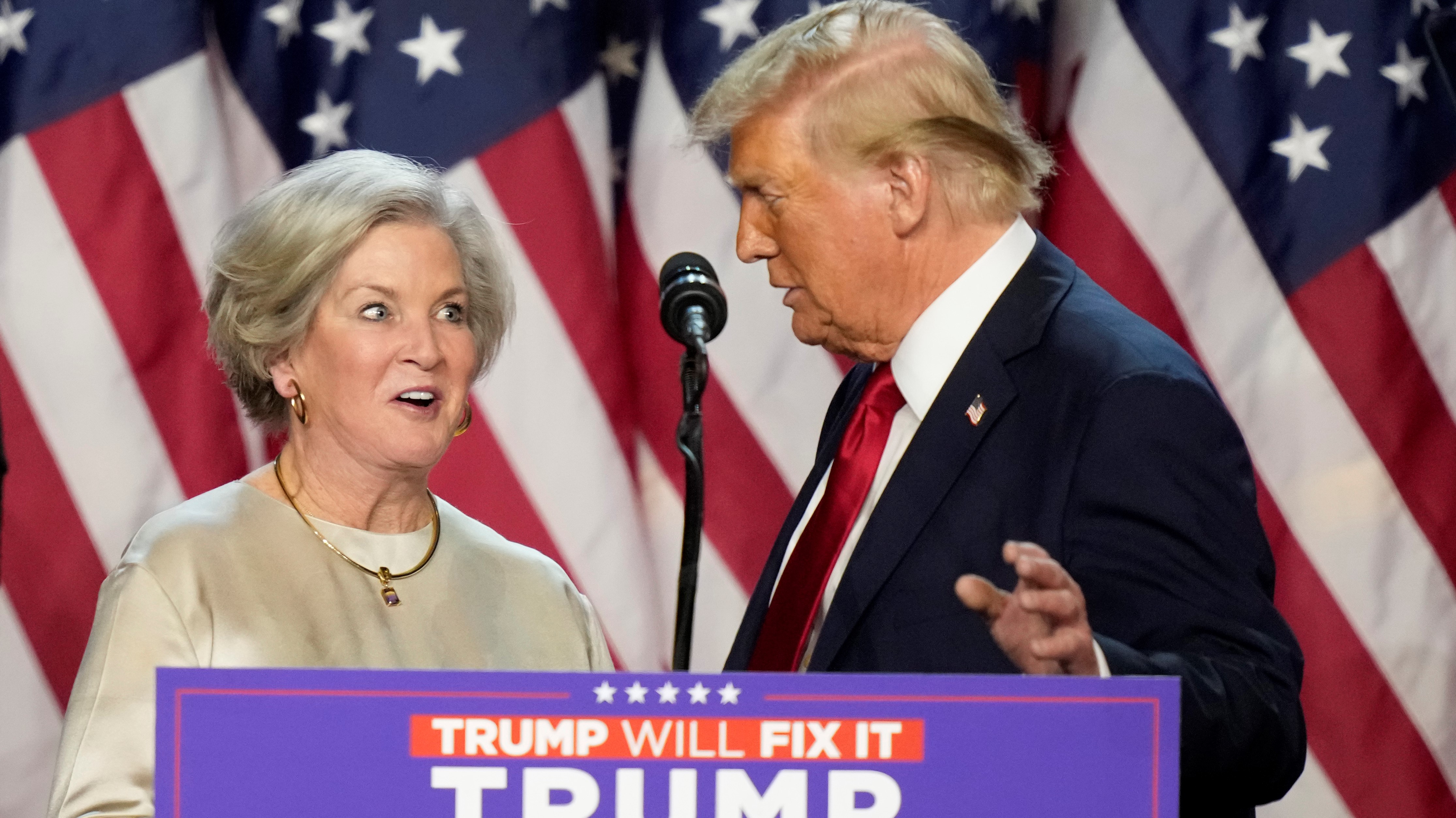 Republican presidential nominee former President Donald Trump brings Susie Wiles to the podium at an election night watch party Wednesday, Nov. 6, 2024, in West Palm Beach, Fla.