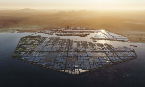 Aerial view of a futuristic, hexagonal water city with grid-like structures, surrounded by ocean and set against a desert landscape at sunset