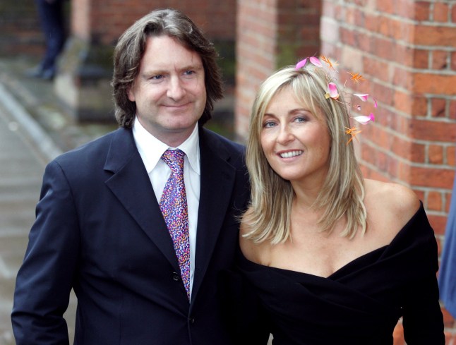 Mandatory Credit: Photo by Carl Fox/REX/Shutterstock (548546t) Fiona Phillips with her husband Martin Frizzell THE WEDDING OF KATE GARRAWAY AND DEREK DRAPER AT THE PARISH CHURCH OF ST MARY THE VIRGIN, LONDON, BRITAIN - 10 SEP 2005