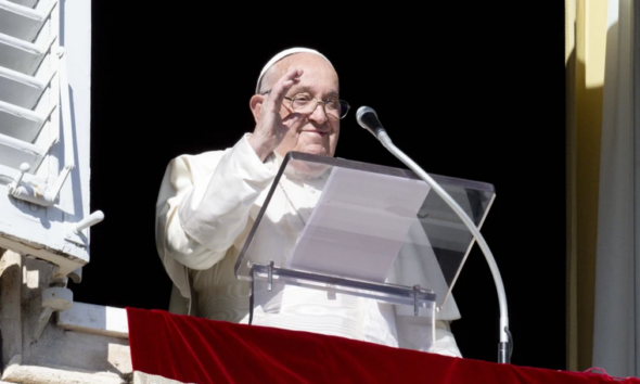 Pope Francis waves to pilgrims gathered in St. Peter’s Square from his window in the Apostolic Palace during his Angelus address on the Solemnity of All Saints, Nov. 1, 2024.