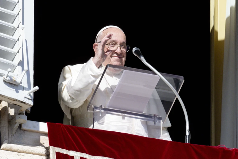 Pope Francis waves to pilgrims gathered in St. Peter’s Square from his window in the Apostolic Palace during his Angelus address on the Solemnity of All Saints, Nov. 1, 2024.