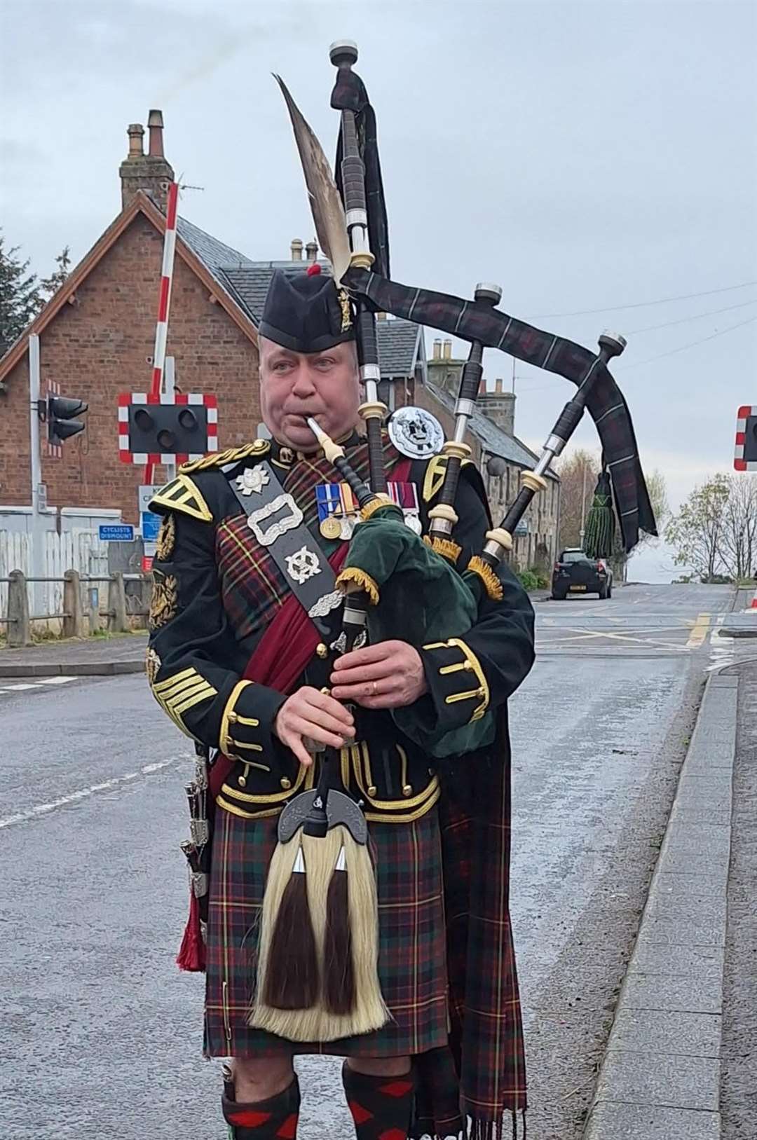 Military piper Colin Simpson, who hails from Brora and has had a distinguished piping career, played at the village's Remembrance Sunday parade and service.