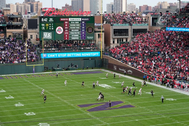 The Northwestern Wildcats offense drives against the Ohio State Buckeyes defense during the second half of the NCAA football game at Wrigley Field in Chicago on Saturday, Nov. 16, 2024. Ohio State won 31-7.