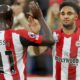 Goalscorers Kevin Schade and Yoane Wissa celebrate during Brentford's Premier League clash with Leicester