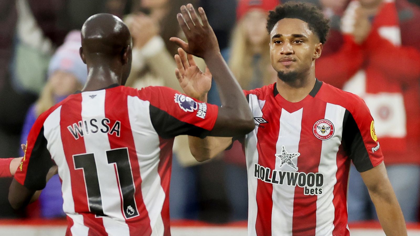 Goalscorers Kevin Schade and Yoane Wissa celebrate during Brentford's Premier League clash with Leicester