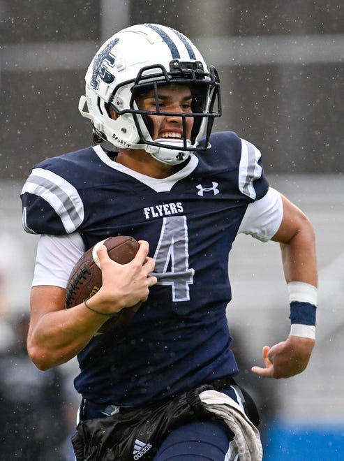 Framingham senior captain Matheus Silva runs the ball during the annual Thanksgiving Day football game at Memorial Field in Natick, Thursday, Nov. 28, 2024. Natick High School defeated Framingham High School 42-15.