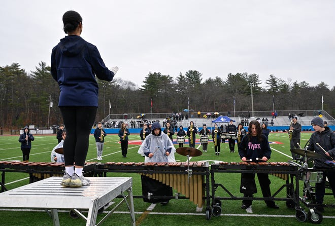 Members of the Framingham Flyers marching band perform their halftime show during the annual Thanksgiving Day football game between Natick and Framingham at Memorial Field in Natick, Thursday, Nov. 28, 2024. Natick High School defeated Framingham High School 42-15.