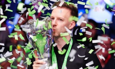 Judd Trump celebrates with the UK Snooker Championship trophy for the second time