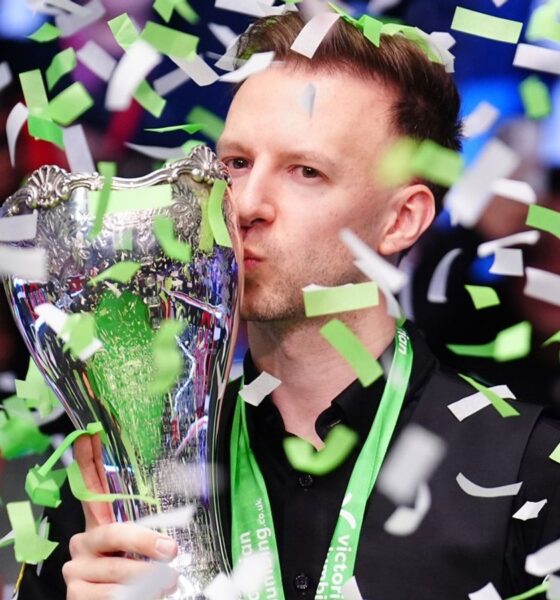 Judd Trump celebrates with the UK Snooker Championship trophy for the second time