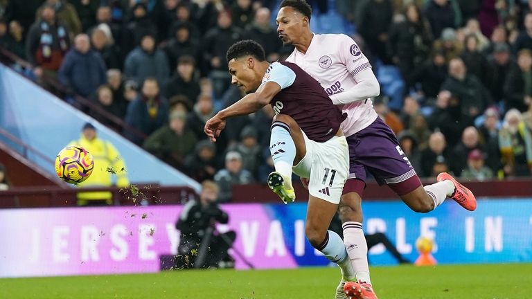 Aston Villa's Ollie Watkins (left) is fouled by Brentford's Ethan Pinnock in the penalty area 