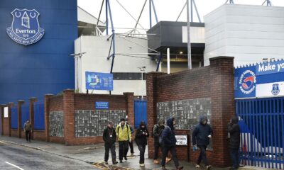 People walk outside Goodison Park as the Premier League soccer match between Everton and Liverpool is called off due to storm Darragh at Goodison Park, in Liverpool, England, Saturday Dec 7, 2024. (AP Photo/Rui Vieira)