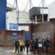 People walk outside Goodison Park as the Premier League soccer match between Everton and Liverpool is called off due to storm Darragh at Goodison Park, in Liverpool, England, Saturday Dec 7, 2024. (AP Photo/Rui Vieira)