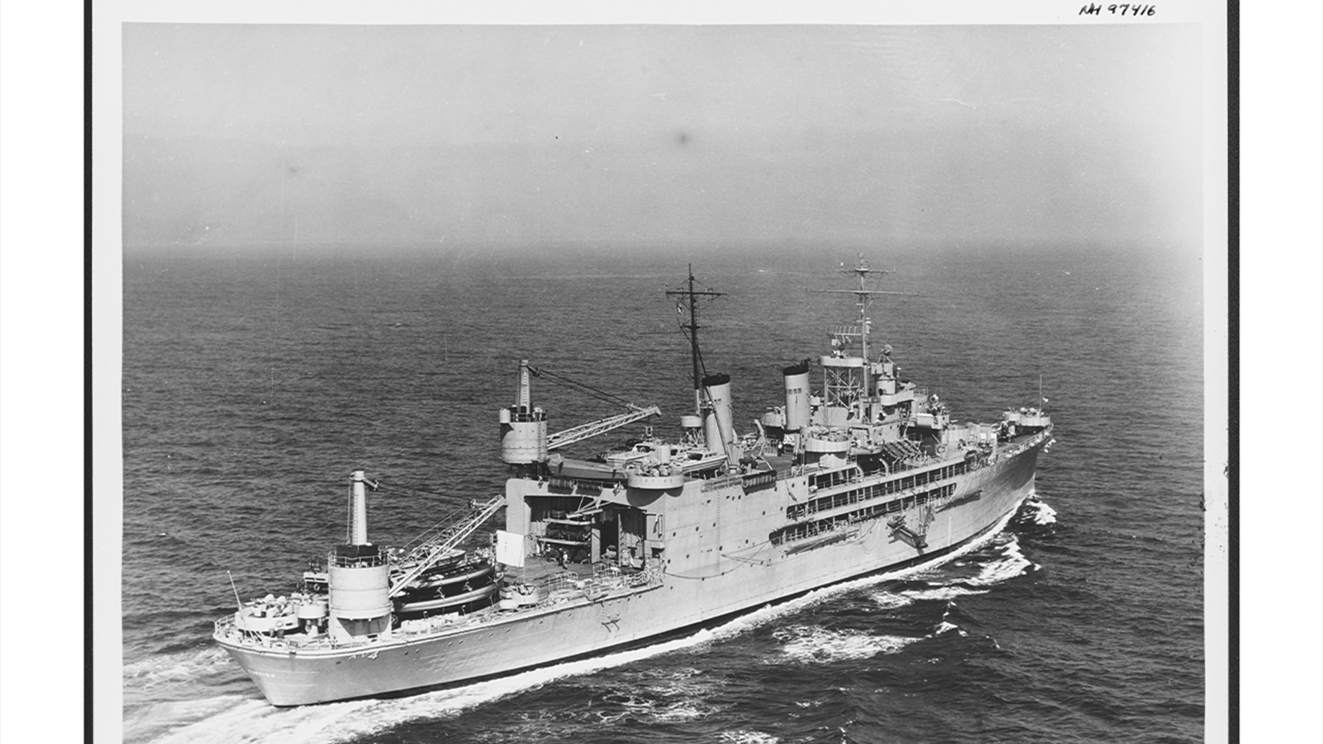 The USS Curtiss is seen underway at sea, 1954.