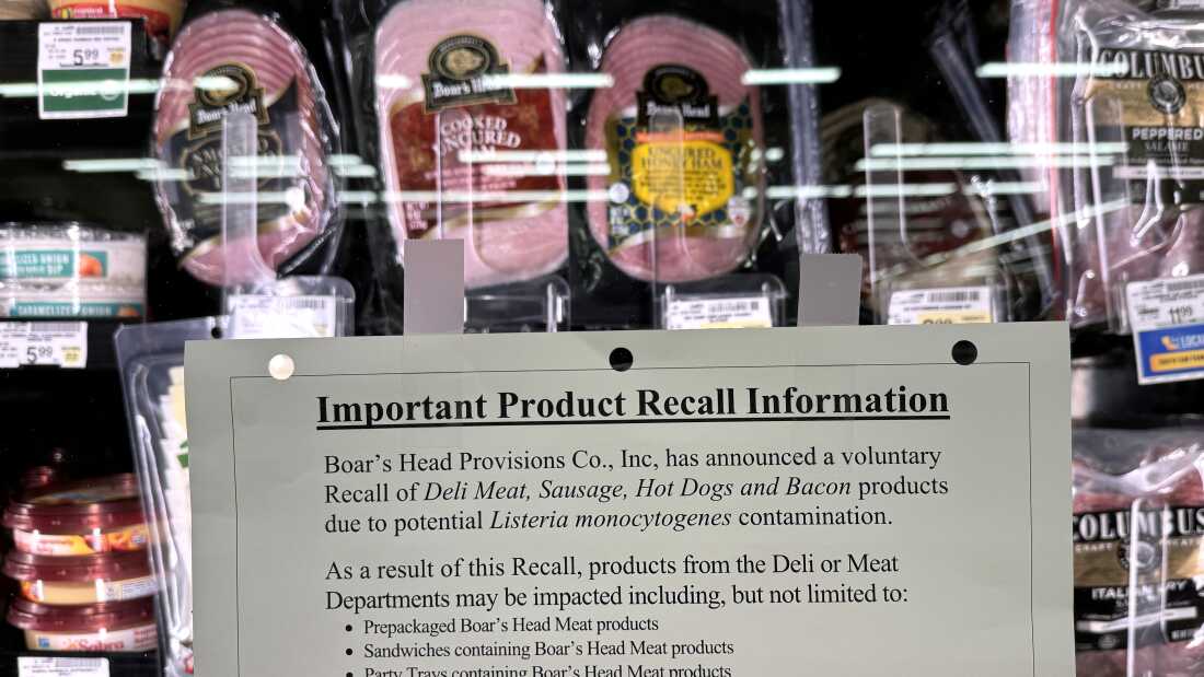 A recall notice citing listeria contamination risks is posted next to a case featuring Boar's Head meats in a Safeway store in San Rafael, Calif.