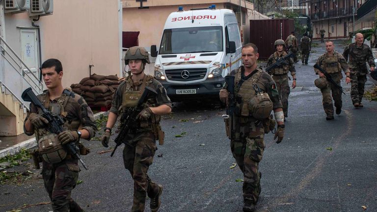 This photo provided Sunday Dec.15, 2024 by the French Army shows soldiers patrolling in the French territory of Mayotte in the Indian Ocean, after Cyclone Chido caused extensive damage with reports of several fatalities. (Etat Major des Arm..es via AP)