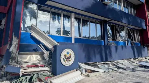 Getty Images  This photo shows a general view of a severely damaged building housing the embassies of the United States, United Kingdom, and New Zealand after a powerful earthquake struck Port Vila