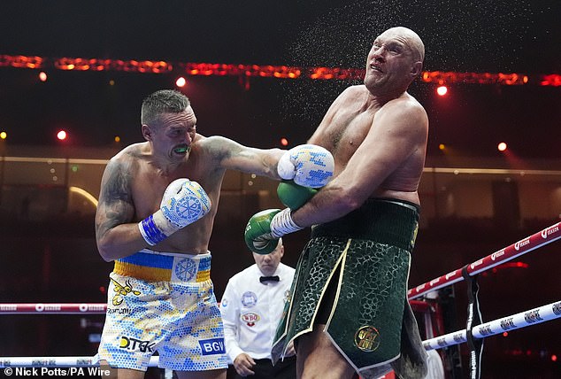 Tyson's aim during the rematch was to claim the unified heavyweight titles - seven months after suffering his first professional loss against the Ukrainian, 37 (Tyson and Oleksandr pictured in May)