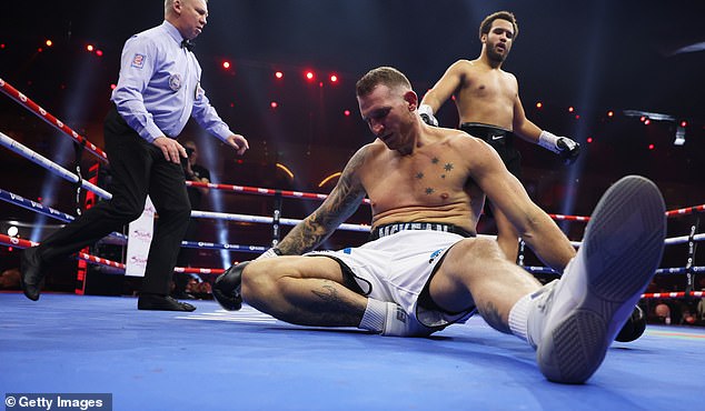 The British star, 19, left Demsey McKean (bottom) on the floor to extend his record to 11-0