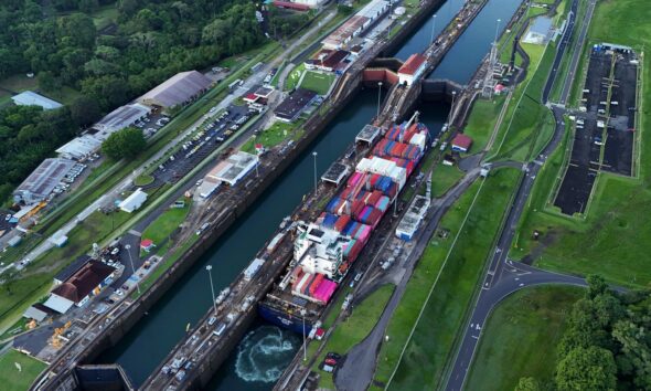 FILE - A cargo ship traverses the Agua Clara Locks of the Panama Canal in Colon, Panama, Sept. 2, 2024. (AP Photo/Matias Delacroix, File)