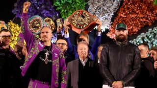 Today's Usyk vs Fury 2 weigh-in – Usyk and Fury with Frank Warren standing in the middle of the shot