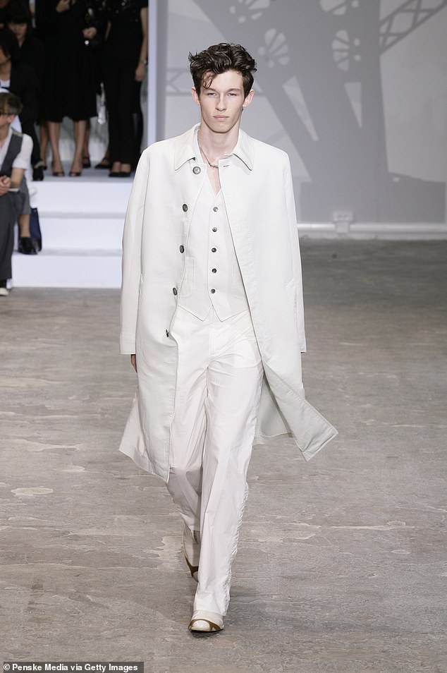 One of his first modeling breaks saw him walk the runway for Louis Vuitton in their 2009 spring/summer Menswear show (pictured)