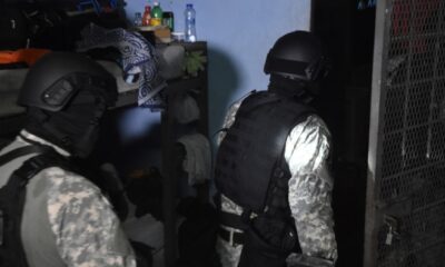 Police officers entering a building