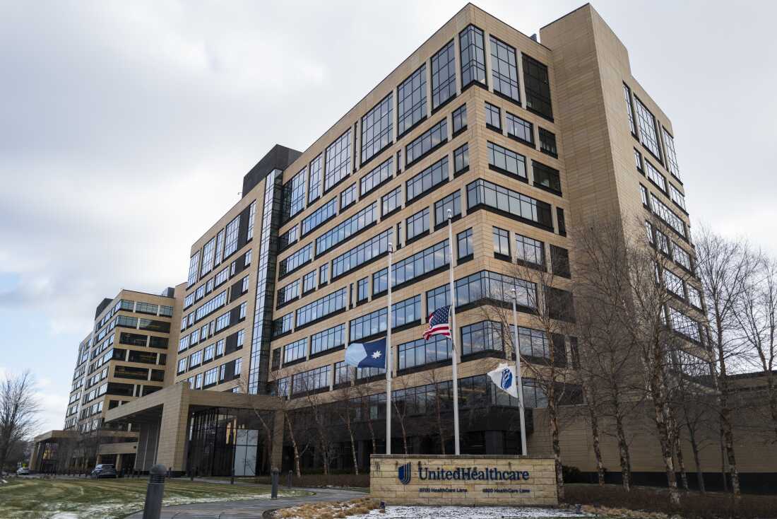 Flags fly at half mast outside the United Healthcare corporate headquarters in Minnetonka, Minnesota.  