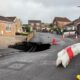 ‘It was very scary’: Huge 60ft-deep sinkhole opens up in quiet residential cul-de-sac