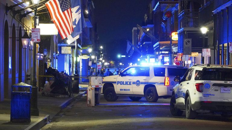 Police vehicles are parked near the site of a fatal truck attack in New Orleans, Louisiana, on Jan. 1, 2025. At least 15 people were killed and dozens injured in a suspected terrorist attack earlier in the day when a pickup truck was driven into a crowd celebrating New Year's Day in a popular tourist spot in the southern U.S. city, according to U.S. media. (Kyodo via AP Images) ==Kyodo