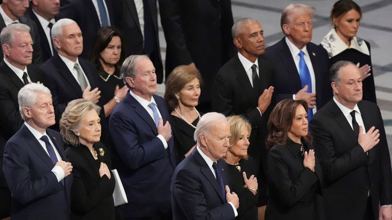 Front row, from left, President Joe Biden, first lady Jill Biden, Vice President Kamala Harris and second gentleman Doug Emhoff and second row from left, former President Bill Clinton, former Secretary of State Hillary Clinton, former President George W. Bush, Laura Bush, former President Barack Obama, President-elect Donald Trump and Melania Trump, stand during the state funeral for former President Jimmy Carter at Washington National Cathedral in Washington, Thursday, Jan. 9, 2025. (AP Photo/Jacquelyn Martin)