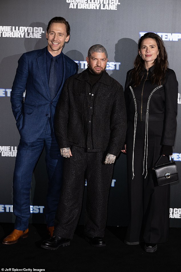 Tom looked incredibly dapper in a blue suit as he posed up a storm on the carpet alongside his co-star Hayley Atwell, 42, and British director Jamie Lloyd, 44