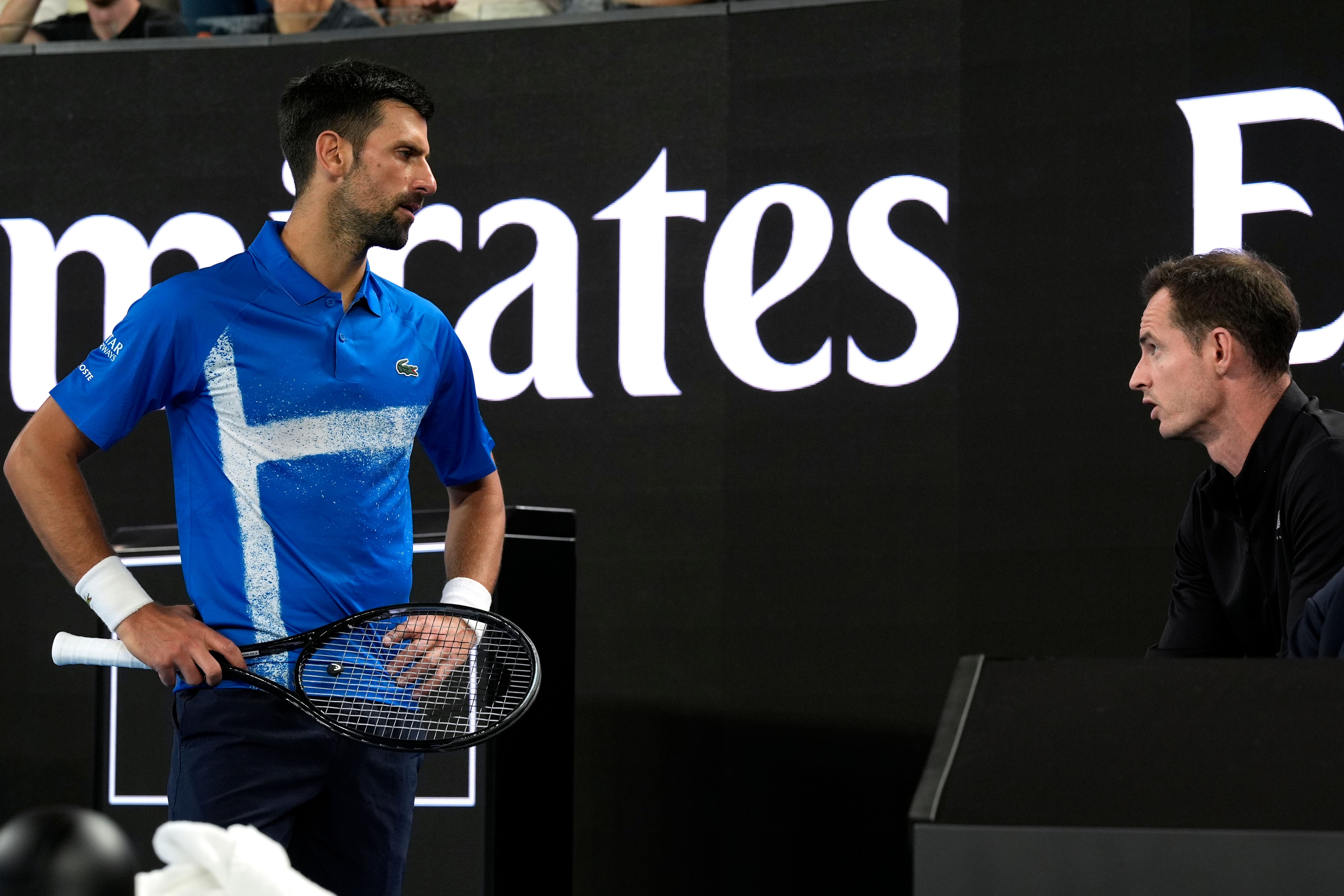 Novak Djokovic, left, talks to coach Andy Murray