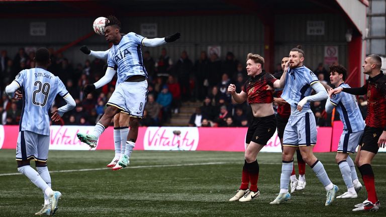 Yves Bissouma wins a header for Spurs at Tamworth