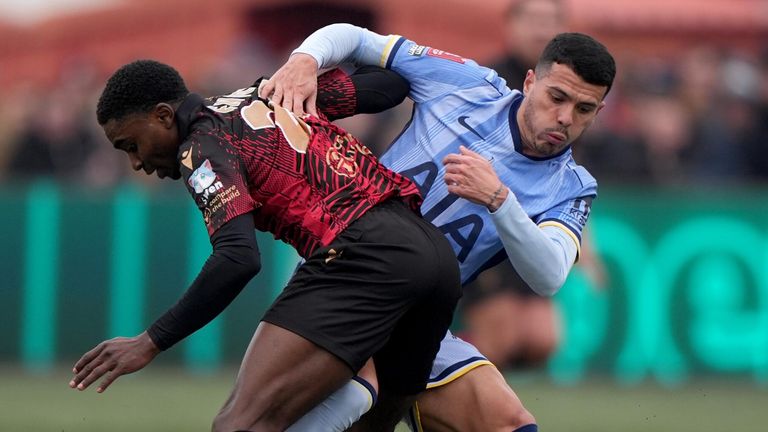 Beck-Ray Enoru and Pedro Porro battle for the ball