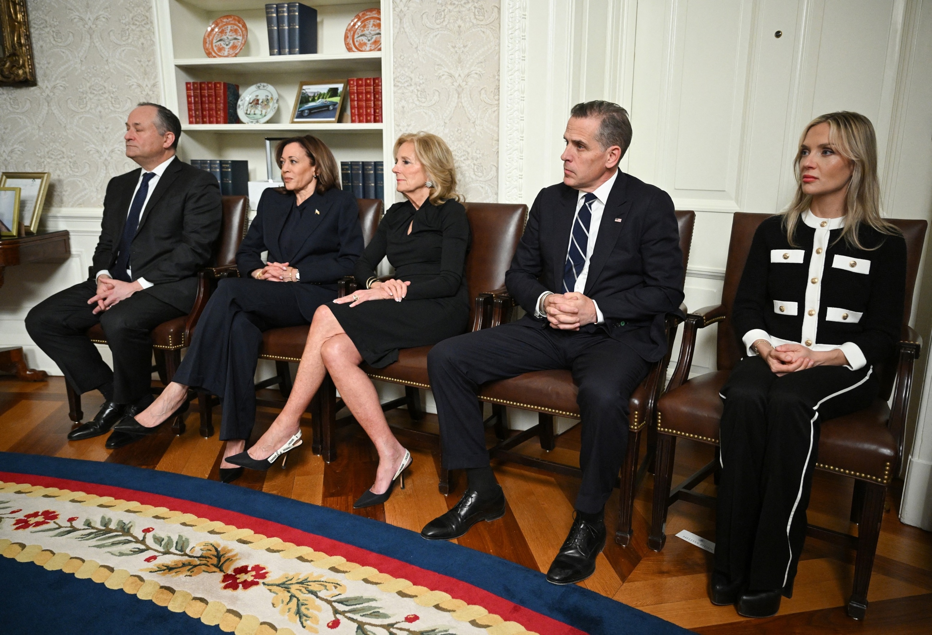 PHOTO: (L-R) Second Gentleman Doug Emhoff, Vice-President Kamala Harris, First Lady Jill Biden, Hunter Biden and his wife Melissa Cohen Biden listen to President Joe Biden in the Oval Office of the White House in Washington, D.C., on Jan. 15, 2025.