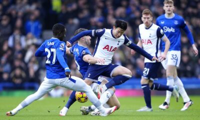 Everton's Idrissa Gueye and James Tarkowski tackle Tottenham's Heung-Min Son