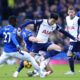 Everton's Idrissa Gueye and James Tarkowski tackle Tottenham's Heung-Min Son