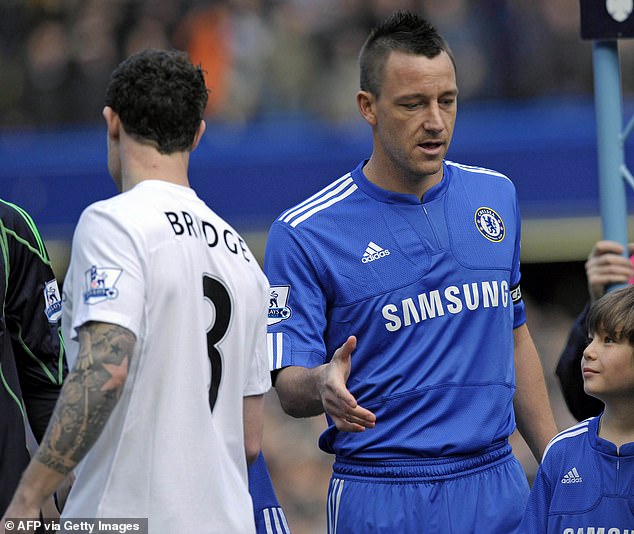 The ex Chelsea defender was set to fight KSI in Manchester on March 29 but he dramatically withdrew just two days later in a statement posted on Monday (Terry and Bridge on the pitch together in 2010)