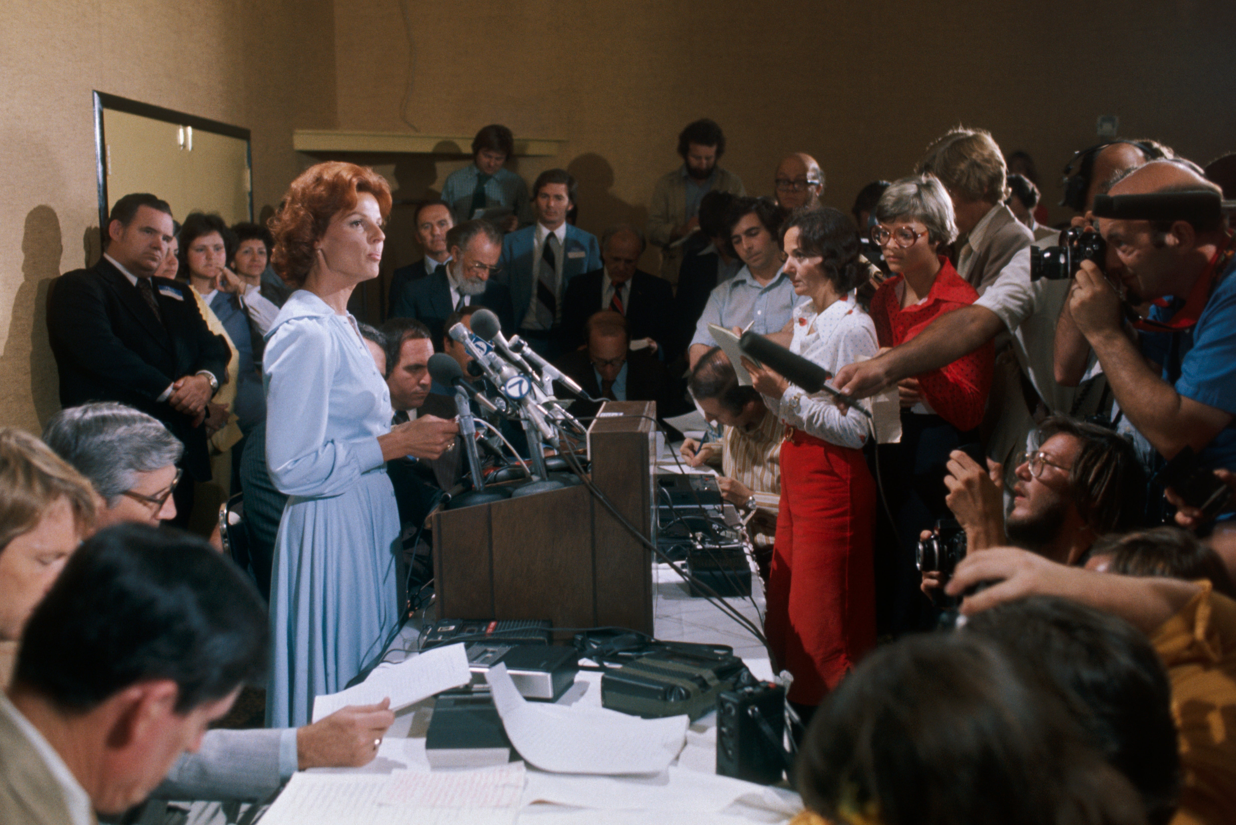 Bryant speaking at a press conference in 1977