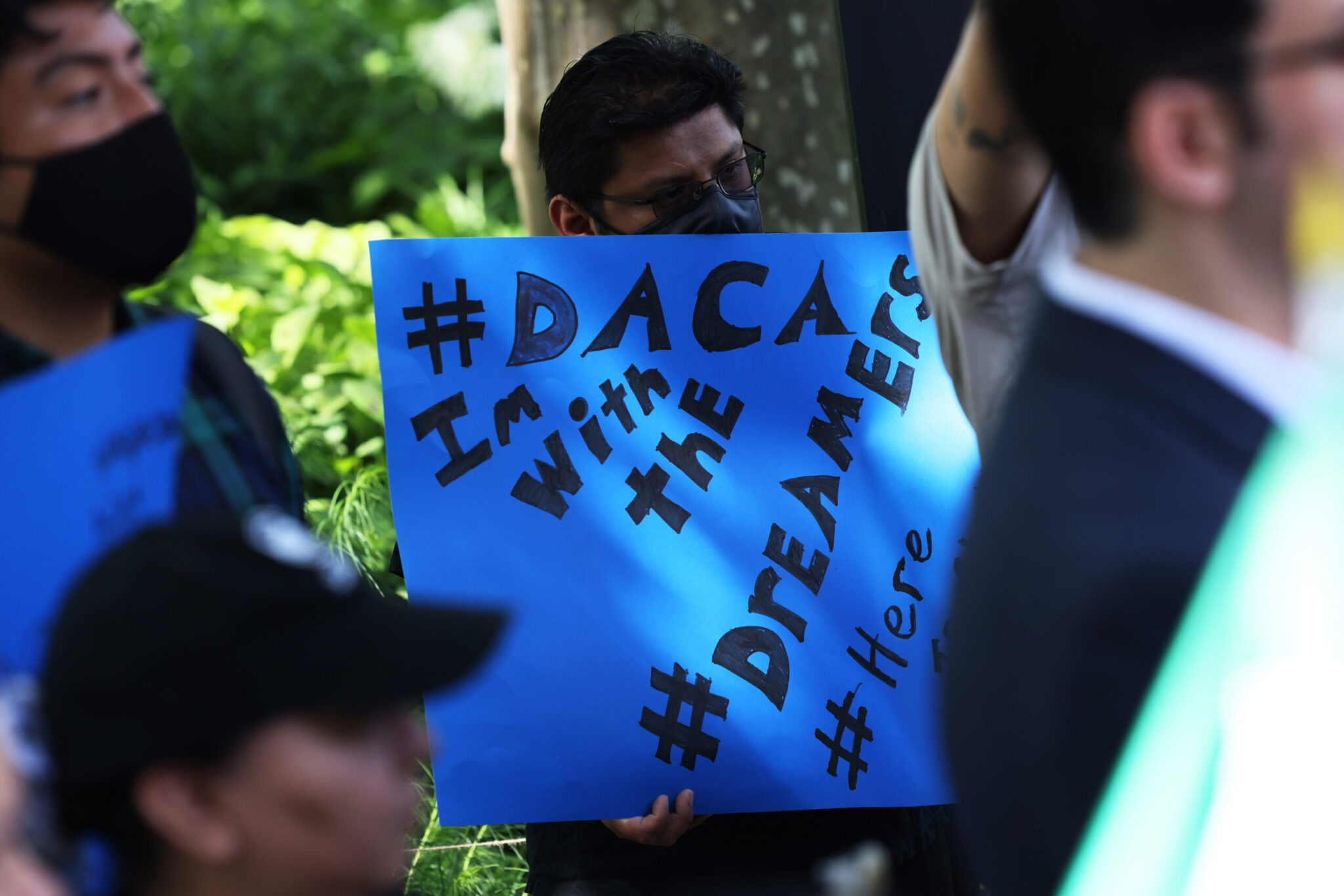 People gather for a rally to celebrate the 10th anniversary of the Deferred Action for Childhood Arrivals program in Battery Park on June 15, 2022, in New York City. (Photo by Michael M. Santiago/Getty Images)