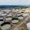 An aerial view of oil storage containers near the Chevron Pasadena Refinery in June 2024 in Pasadena, Texas. The U.S. is the world's largest oil producer. President Trump says he is declaring a national energy emergency as one of his first acts in office.